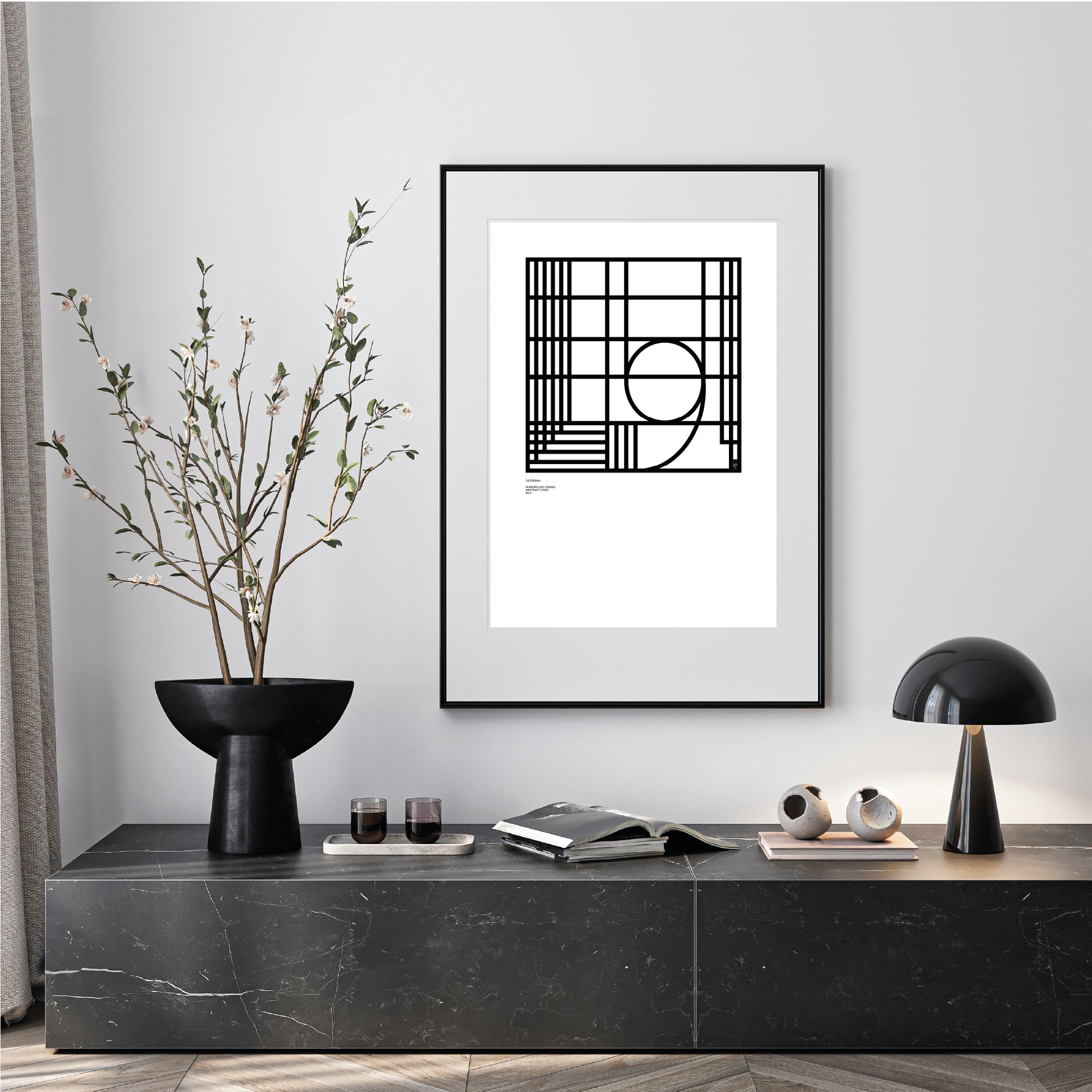 Modern interior with a black and white numerology number 9 abstract limited edition print on a gray wall.